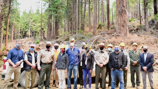 Secretary Haaland poses with park staff at Sequoia National Park