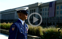 A video still of a man in uniform. 