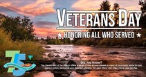 Landscape view of a flowing river with Veterans Day, honoring all who served graphic text. 