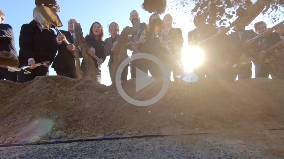 A group of people dig a hole with shovels