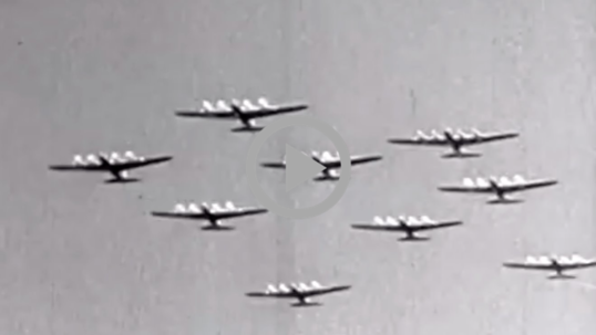 WWII airplanes fly over 