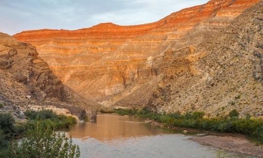 River winds through red, rocky landscape. Photo by Todd Leeds, BLM.