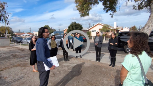 Secretary Haaland listens to environmental activists in a Los Angeles neighborhood