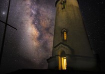 The milky way over a lighthouse.