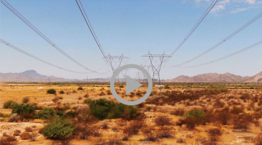 power transmission lines in a desert landscape 