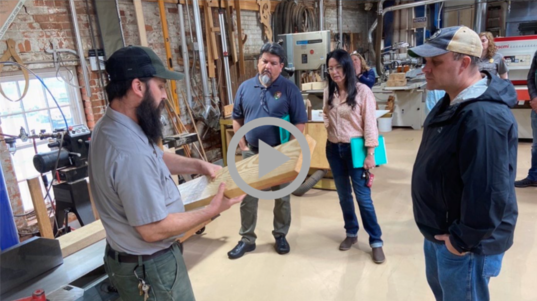 Assistant Secretary for Fish and Wildlife and Parks and NPS Director view a demonstration in a workshop at the Historic Preservation Training Center