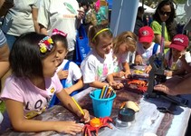 Children at a table doing crafts.