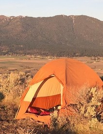 A camping tent in a high desert.