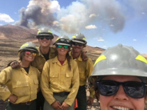 Five firefighters taking a selfie.