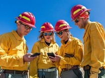BLM Fire employees using handheld devices.