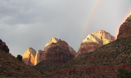 View of a rainbow over buttes in Zion National Park