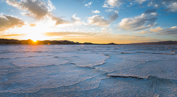 A dry lakebed at sunset.