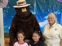 Smokey bear and children.