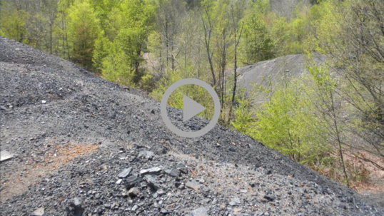 Piles of coal on a rocky hillside