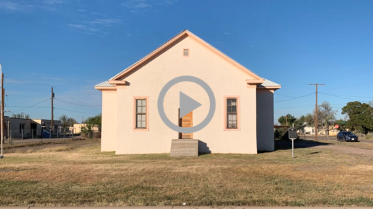 Exterior shot of a small schoolhouse in Texas