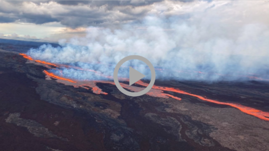 Steaming molten lava flows across a rocky landscape 