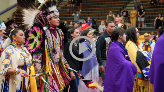 Secretary Haaland joins a procession of Indigenous people at Haskell Indian Nations University 