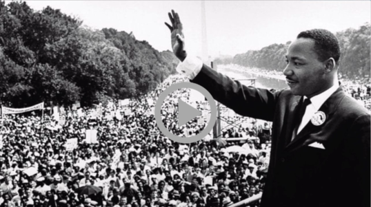 Martin Luther King Jr. waves to the crowd at the Lincoln Memorial during the March on Washington, August 1963.