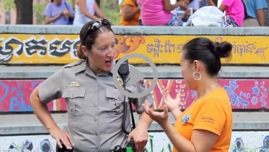A National Park Service law enforcement ranger speaks to a member of the public at a community event 
