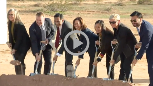 Secretary Haaland joins Vice President Harris and others as they pose with shovels at a groundbreaking ceremony
