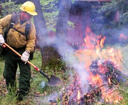 Firefighter working on fire