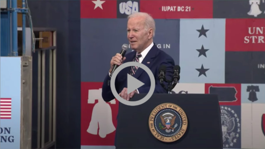 President Biden speaks to a crowd as he announces his budget for fiscal year 2024