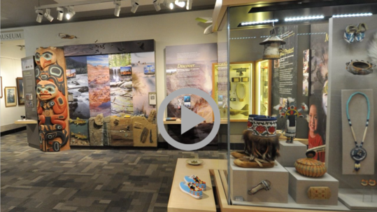 An exhibit hall featuring Indigenous artifacts at the Interior Museum