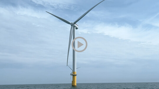 An offshore wind turbine in the ocean