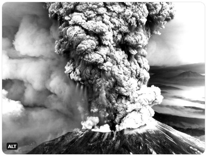 A black and white photo of Mt. St. Helens erupting on May 18, 1980. 