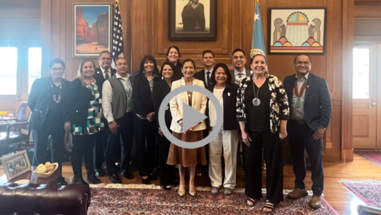 Secretary Haaland poses in her office with members of the Secretary’s Tribal Advisory Committee.