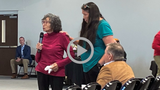 An older Native woman is comforted by a younger woman as she speaks during Interior’s “Road to Healing” event in Minnesota.