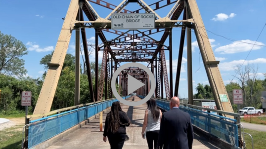 Assistant Secretary for Fish and Wildlife and Parks Shannon Estenoz and others make their way across the Old Chain of Rocks Bridge in St. Louis.