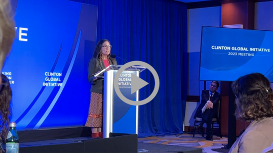 Secretary Haaland speaks from a podium at the Clinton Global Initiative 2023 Meeting.