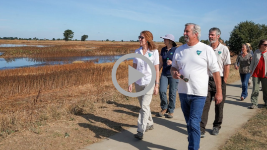 BLM Director Tracy Stone-Manning walks a path with others beside the Cosumnes River in California.