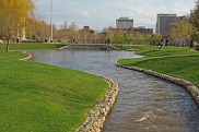 Stream with city buildings in the background