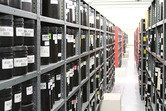 EROS archive, showing film canisters on shelves
