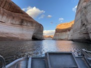 View of Lake Powell From a research boat with rocky shore in the background