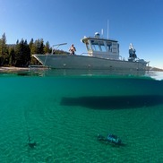 Research vessel floats in clear waters of Lake Tahoe. Photo credit: Tahoe Environmental Research Center