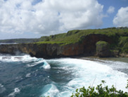 waves crash against cliffs