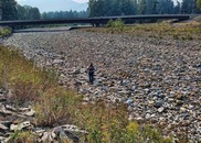 A hydrologic technician from the USGS Idaho Water Science Center measures streamflow in Lightning Creek