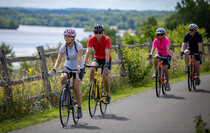ERCA_Niskayuna: Four cyclists on the Canalway Trail overlooking the Mohawk River