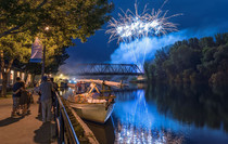 ERCA_Rome: Fireworks explode over the canal during a festival