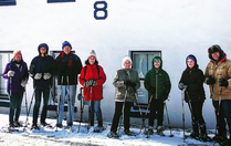 ERCA_Oswego: A group cross country skiers pose for a photo at a lock house