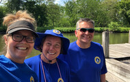 ERCA: Three Water Trail stewards wearing blue shirts pose for a photo beside the canal