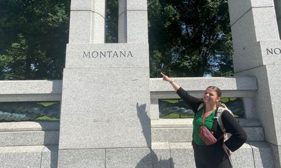 Intern Zoe Belinda with OWF points out her home state of Montana at the World War II Memorial in Washington, D.C. Photo courtesy of Zoe Belinda.