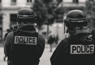 Two police officers standing outside