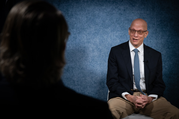 Retired Agent Jeff Higgins talks with DEA staff