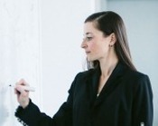 Woman writing on the board