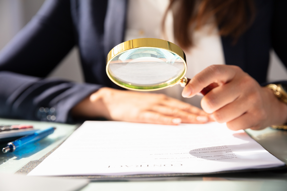 Woman with magnifying glass