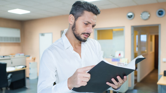 Man reading proposal